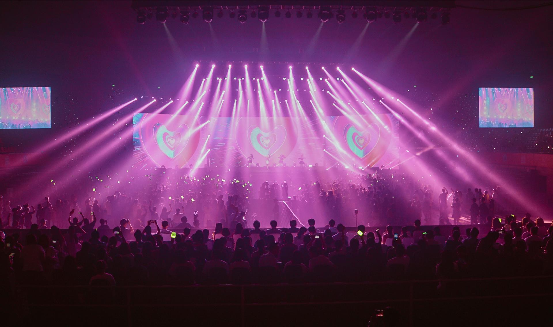 Concert stage with bright pink lighting